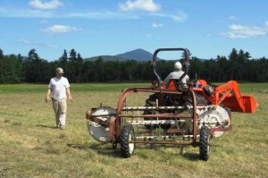 Martin checking out the hay rake.  Mt. Blue in the background